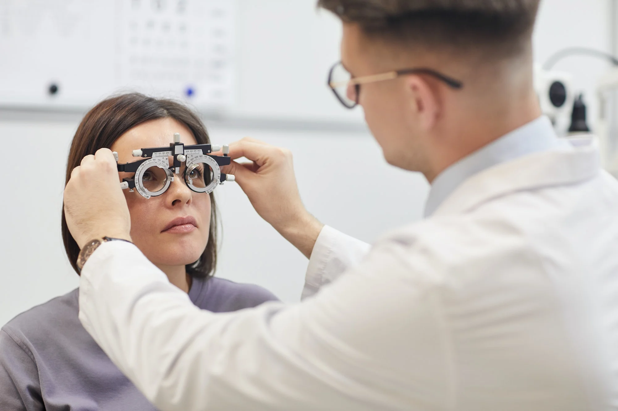 An optometrist performing an eye examination