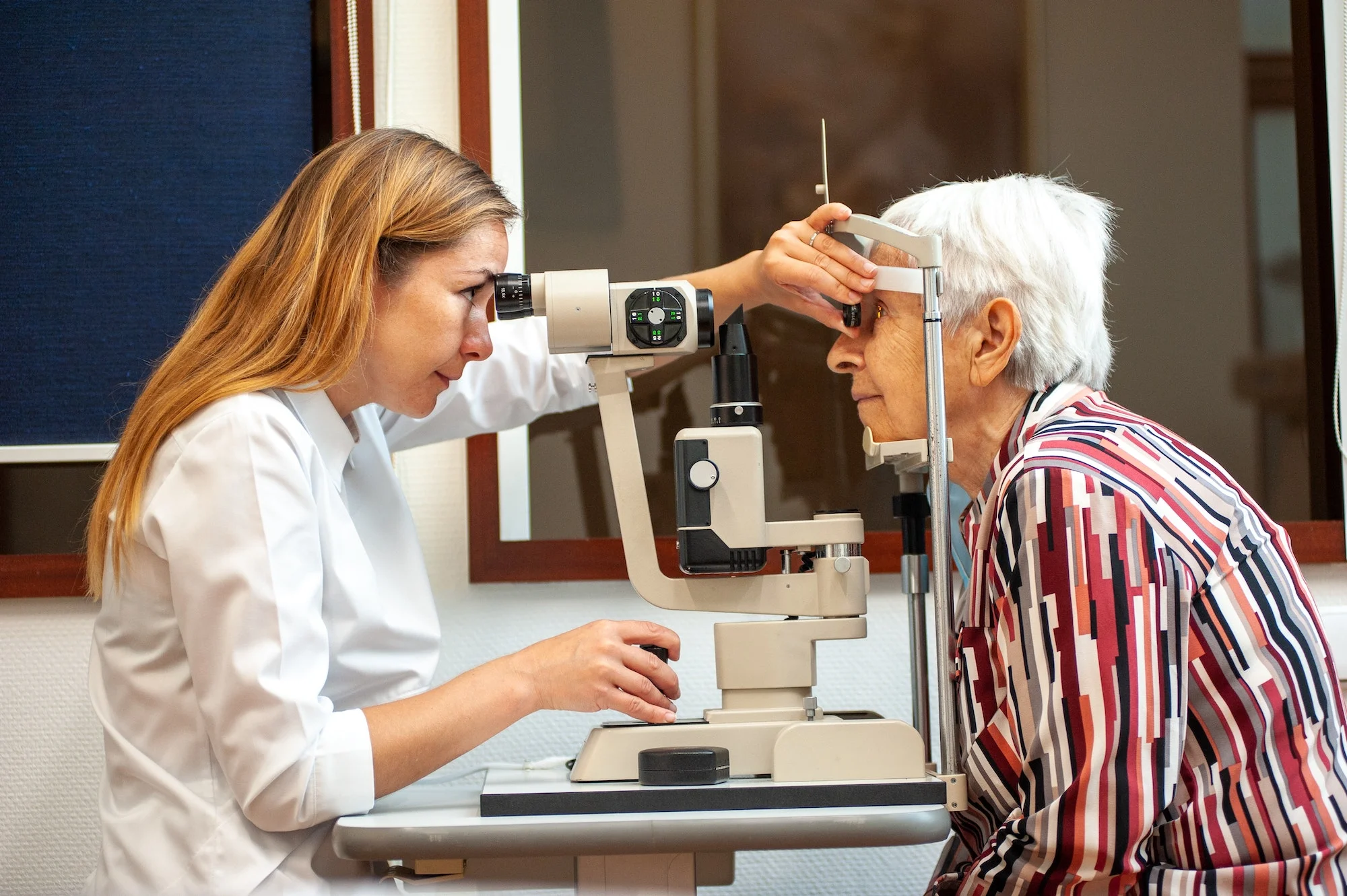 A doctor conducting an eye examination